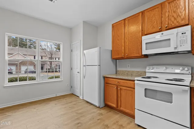 a kitchen with a stove microwave and refrigerator