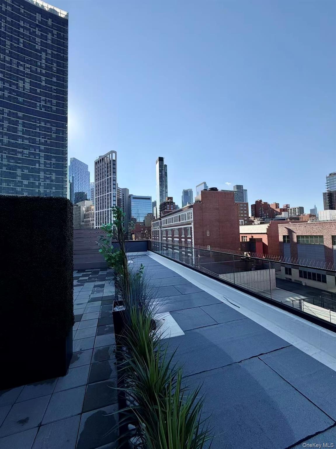 40-09 29th Street, Unit 2C Queens, NY 11101 - Photo 13 of 15 a view of a city with tall buildings