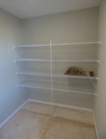 a bedroom with furniture and a chandelier
