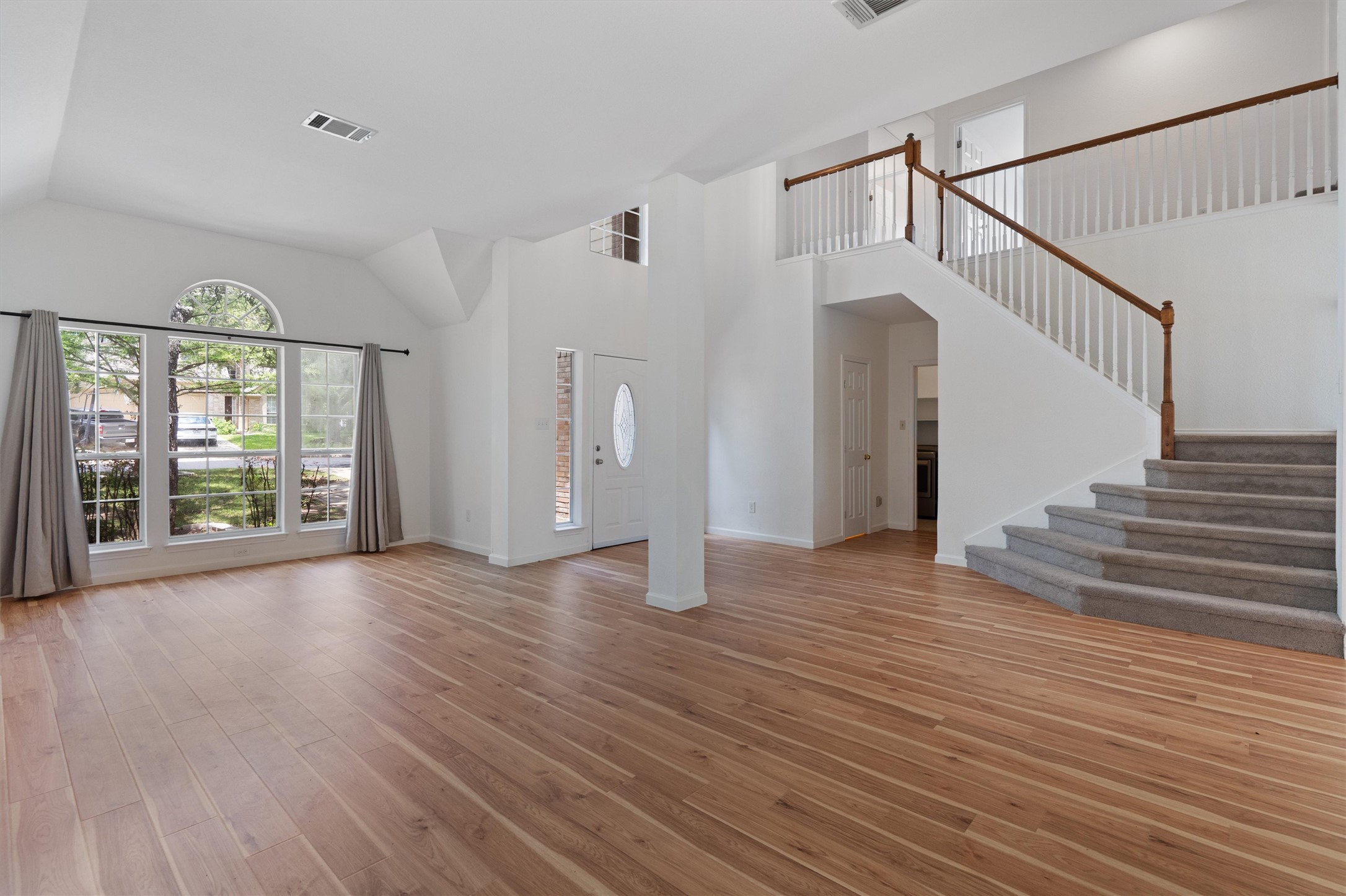 100 Parque Circle Georgetown, TX 78626 - Photo 6 of 39 a view of an empty room with wooden floor and a window