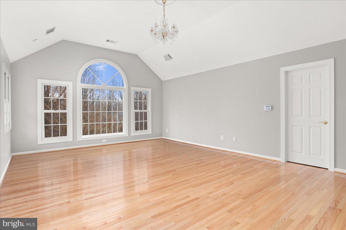 13635 Maidstone Lane Potomac, MD 20854 - Photo 30 of 66 Vaulted ceiling with chandelier