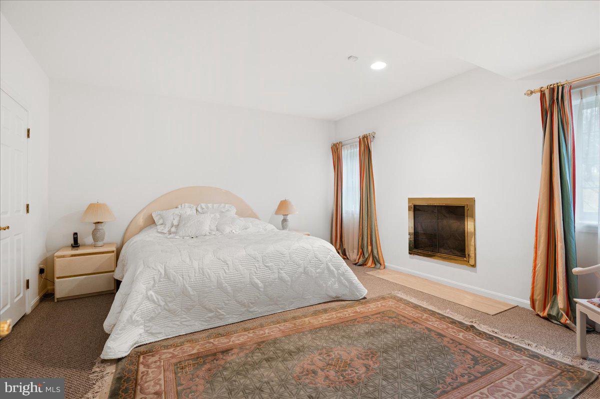 13635 Maidstone Lane Potomac, MD 20854 - Photo 47 of 66 Bedroom with closet, fireplace and...