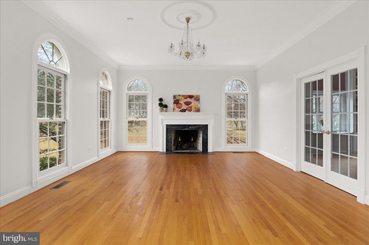 13635 Maidstone Lane Potomac, MD 20854 - Photo 6 of 66 Formal living room w crown molding & wood burn FP
