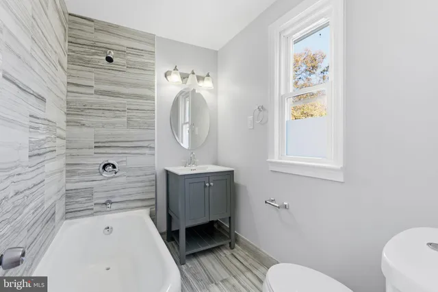 a view of a livingroom with furniture and windows