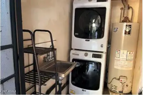 a kitchen with a refrigerator and washer