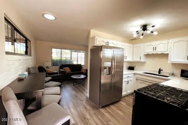 a kitchen with counter top space cabinets and stainless steel appliances