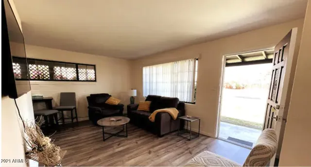 a living room with furniture and a window