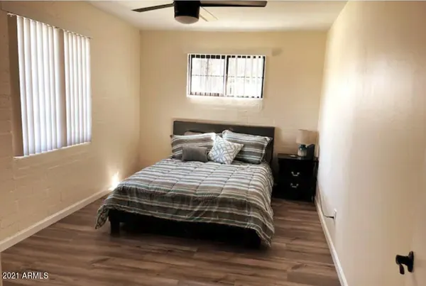 a bedroom with a bed and window