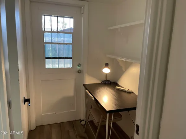 a view of a hallway with workspace