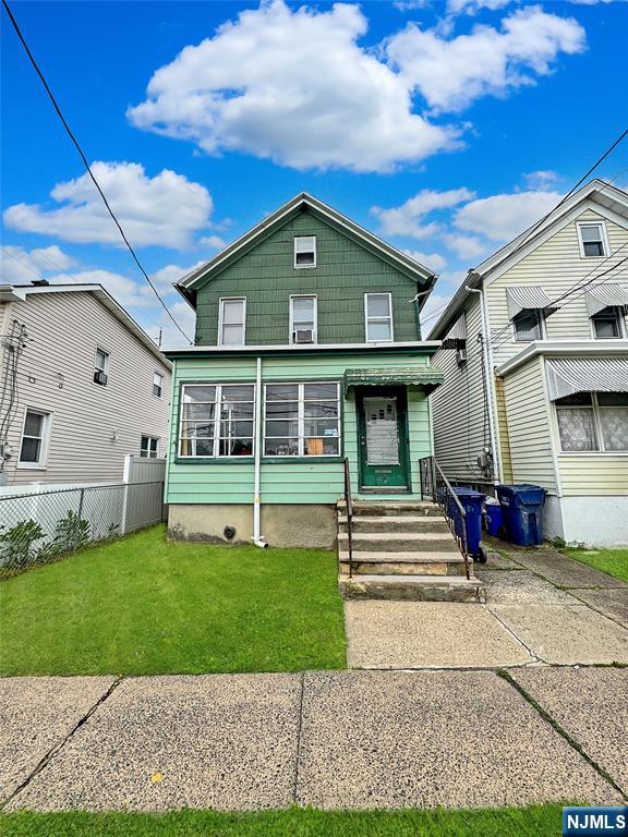 113 Kansas Street Hackensack, NJ 07601 - Photo 1 of 10 a view of a house with a yard
