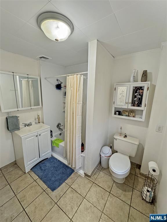 113 Kansas Street Hackensack, NJ 07601 - Photo 6 of 10 a bathroom with a toilet sink and mirror