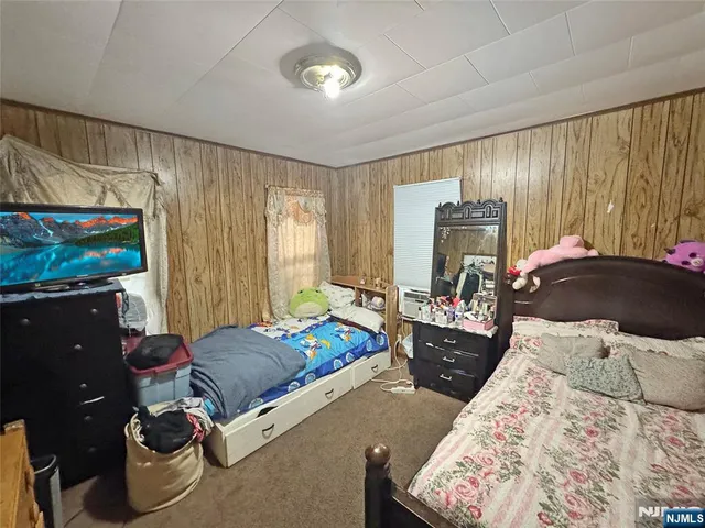 a bed room with a bed and furniture