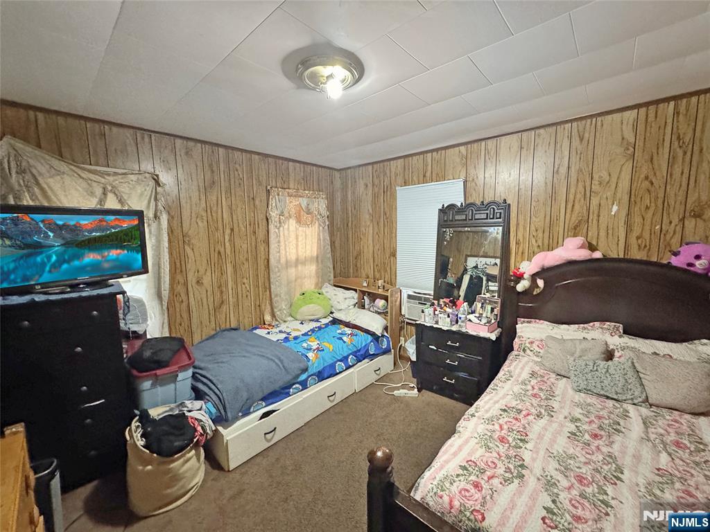 113 Kansas Street Hackensack, NJ 07601 - Photo 7 of 10 a bed room with a bed and furniture