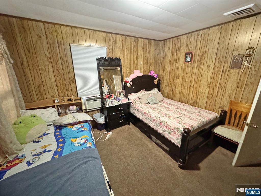 113 Kansas Street Hackensack, NJ 07601 - Photo 8 of 10 a bedroom with a bed and a window