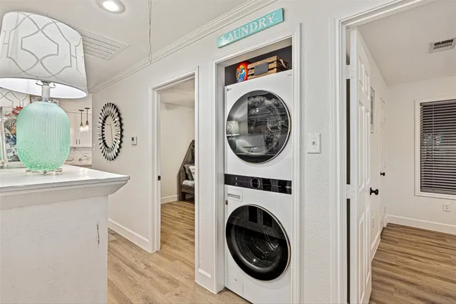 a view of a storage and utility room with a washer dryer