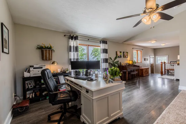a work room with furniture and wooden floor
