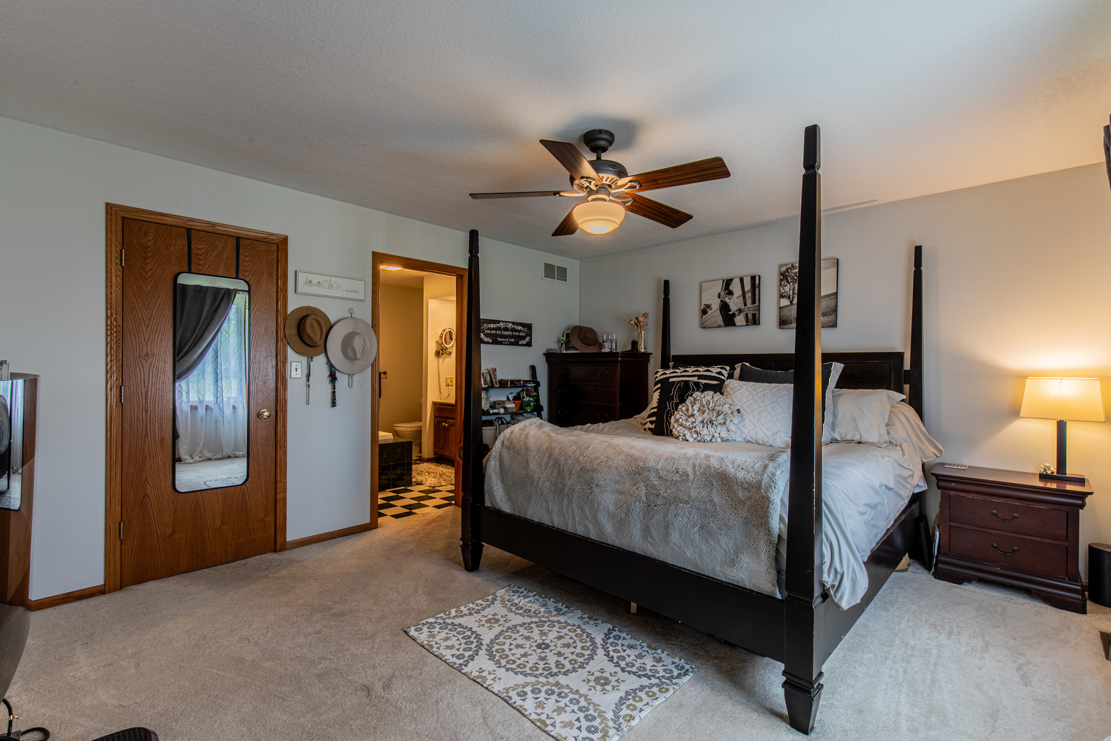 3980 East 4th Road Mendota, IL 61342 - Photo 19 of 44 a bedroom with a bed chandelier and a window