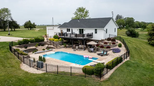 a view of a house with backyard porch and outdoor seating
