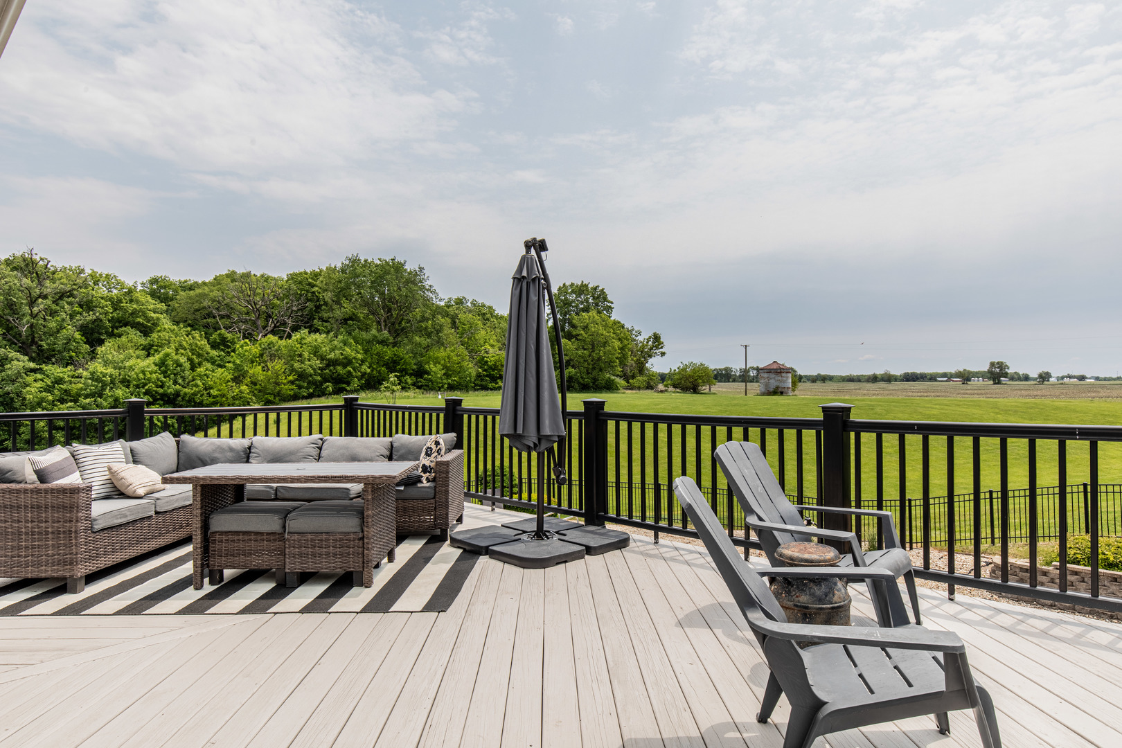 3980 East 4th Road Mendota, IL 61342 - Photo 28 of 44 a view of a balcony with wooden floor and seating space