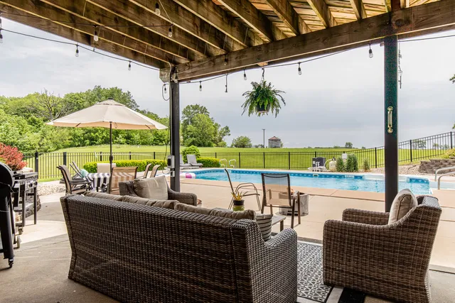 a view of a patio with a table chairs and a patio