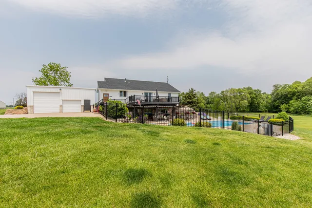 a house view with a sitting space and garden