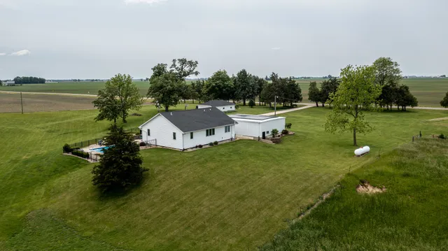 a view of a lake with a house in the background