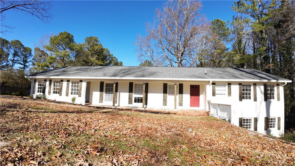 1110 Upper Hembree Road Roswell, GA 30076 - Photo 1 of 51 a front view of a house with a garden