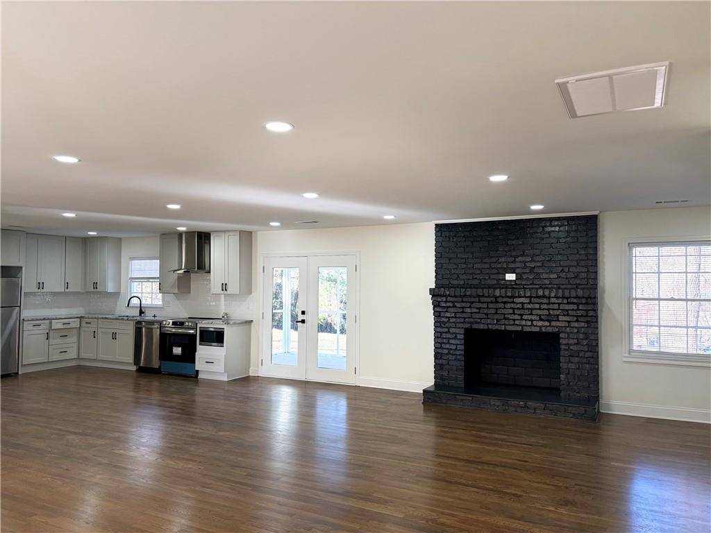 1110 Upper Hembree Road Roswell, GA 30076 - Photo 11 of 51 an open kitchen with a table and chairs in it