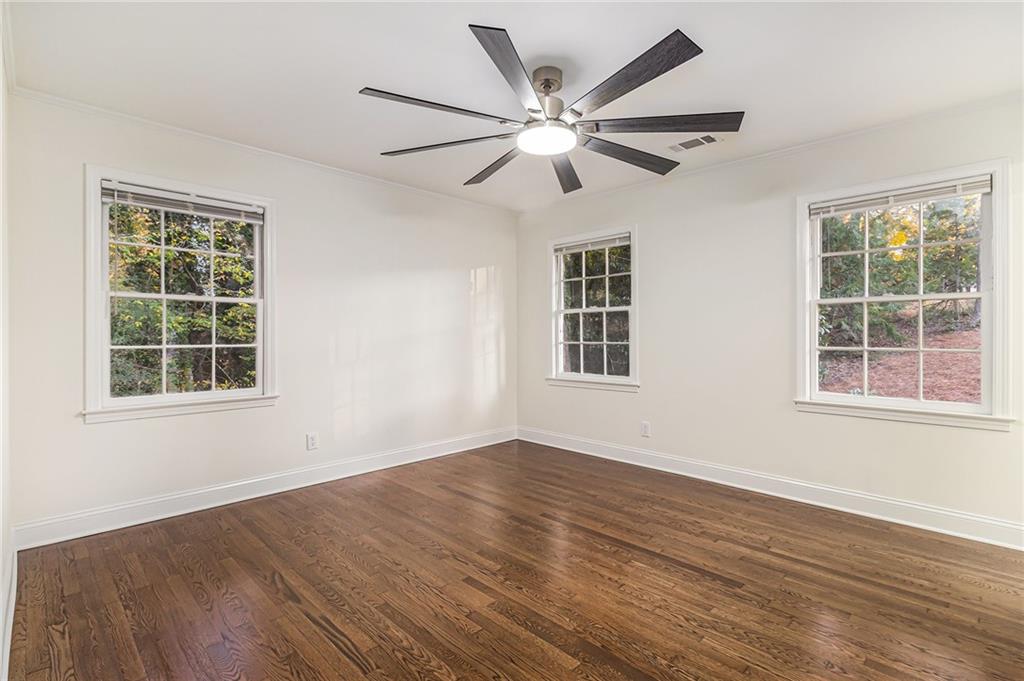 1110 Upper Hembree Road Roswell, GA 30076 - Photo 22 of 51 a view of a livingroom with a ceiling fan and window