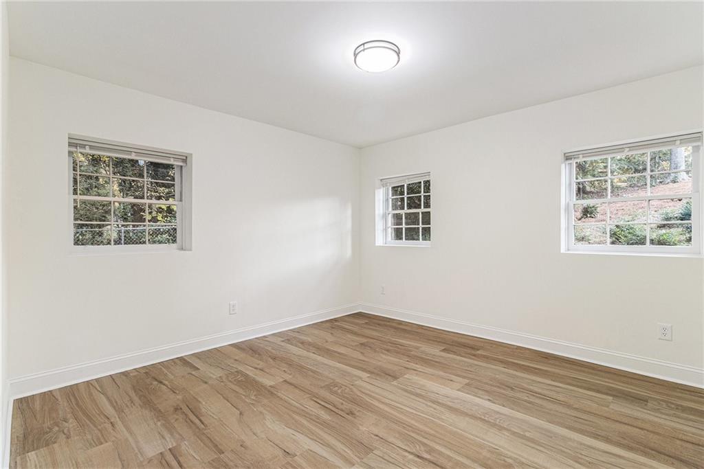 1110 Upper Hembree Road Roswell, GA 30076 - Photo 34 of 51 a view of empty room with wooden floor and fan