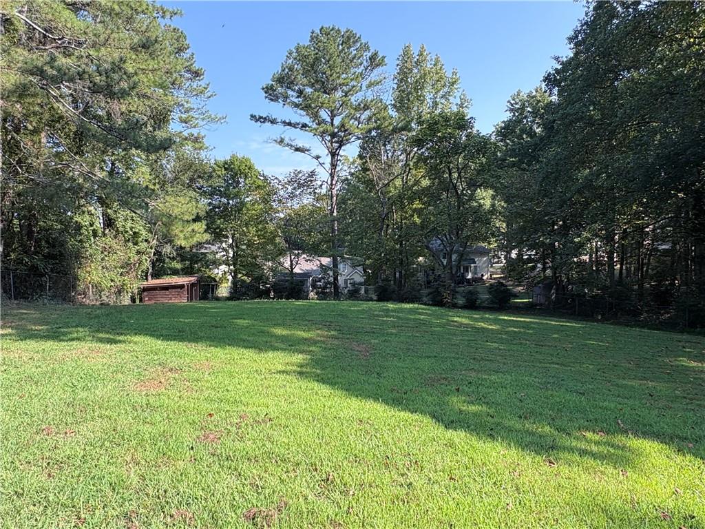 1110 Upper Hembree Road Roswell, GA 30076 - Photo 41 of 51 a front view of a house with a yard