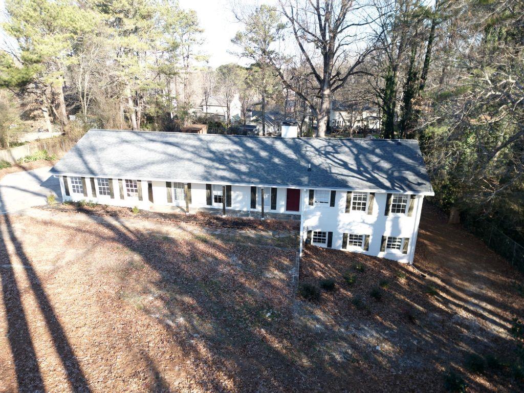 1110 Upper Hembree Road Roswell, GA 30076 - Photo 48 of 51 a view of a house with a yard