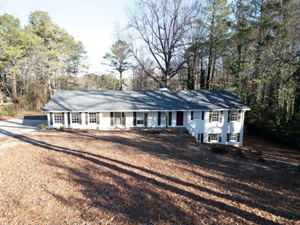 1110 Upper Hembree Road Roswell, GA 30076 - Photo 49 of 51 a front view of a house with a yard