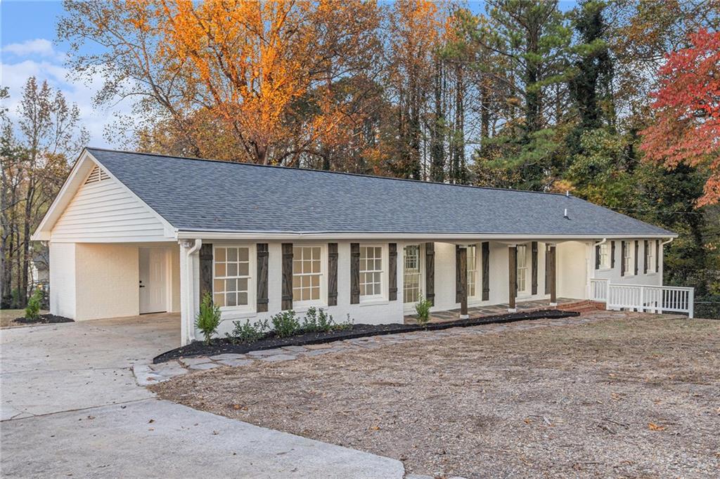 1110 Upper Hembree Road Roswell, GA 30076 - Photo 5 of 51 front view of a house with a yard