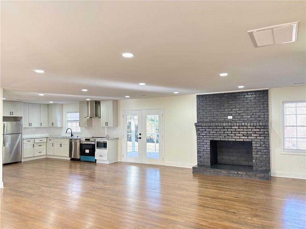 1110 Upper Hembree Road Roswell, GA 30076 - Photo 10 of 51 a view of kitchen with furniture and fireplace