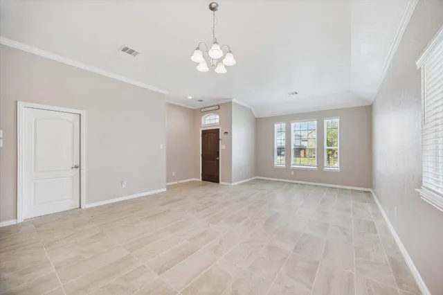 a view of an empty room with a window