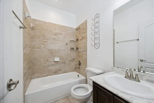 a bathroom with a sink a toilet and a bathtub