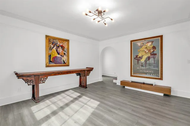 a living room with furniture a rug and a large window