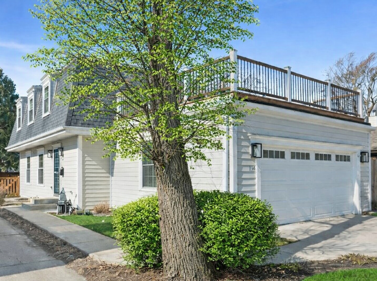 716 Indian Road Glenview, IL 60025 - Photo 1 of 32 a front view of a house with a garden