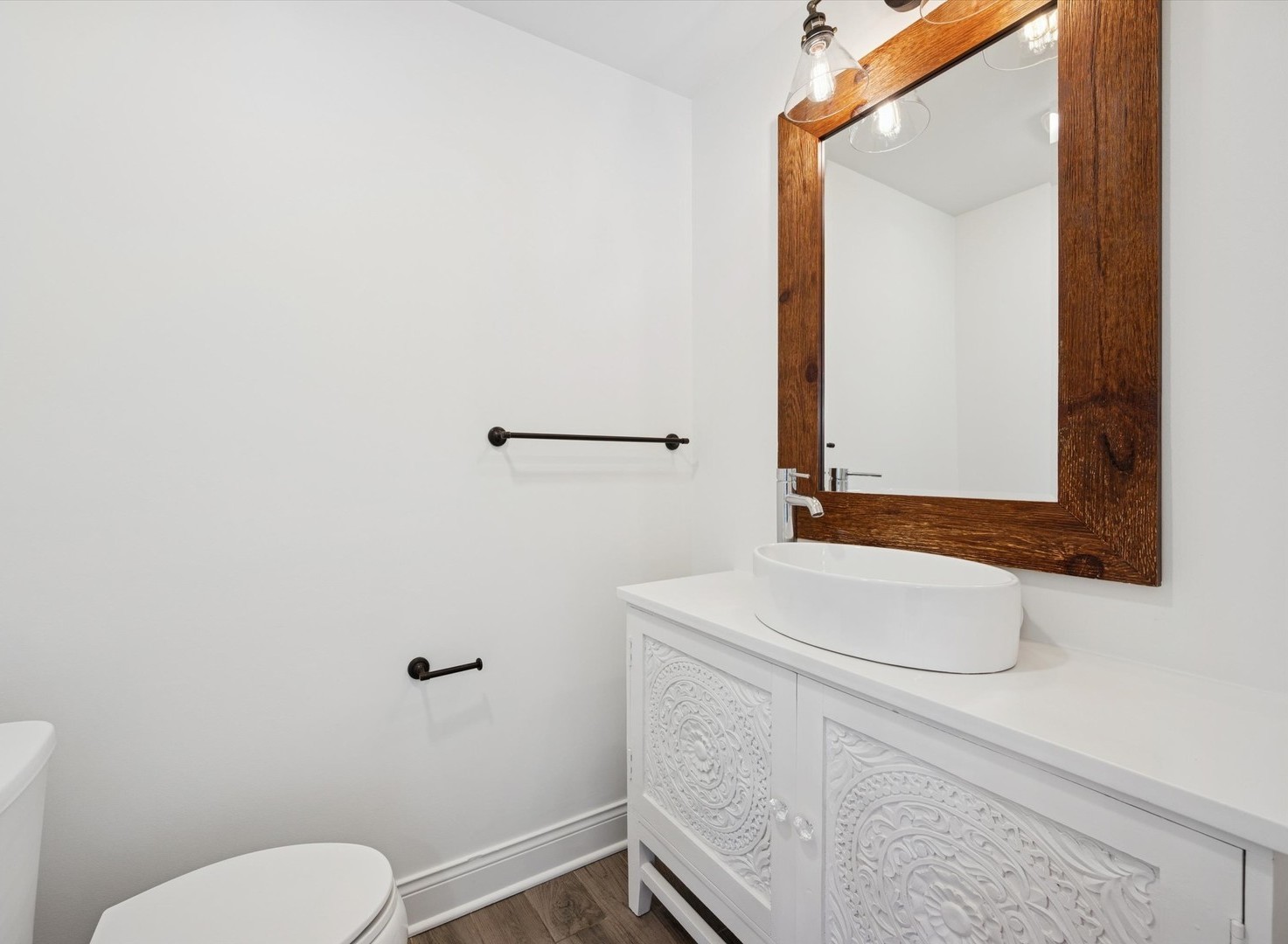 716 Indian Road Glenview, IL 60025 - Photo 13 of 32 a bathroom with a toilet sink and mirror