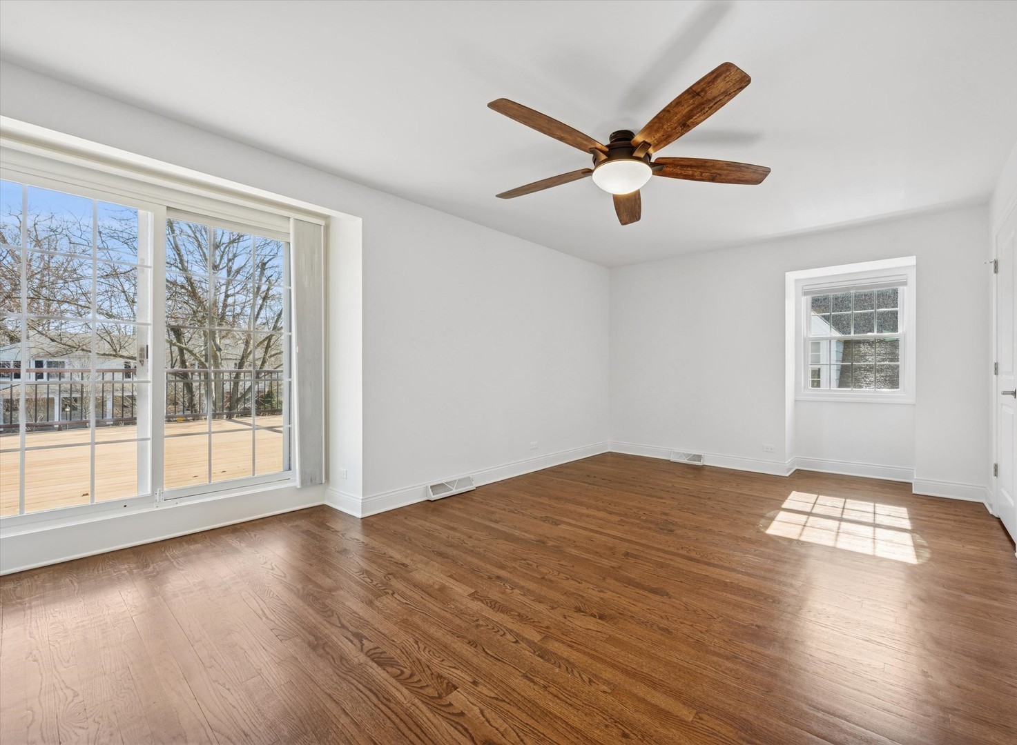 716 Indian Road Glenview, IL 60025 - Photo 14 of 32 a view of empty room with wooden floor and fan