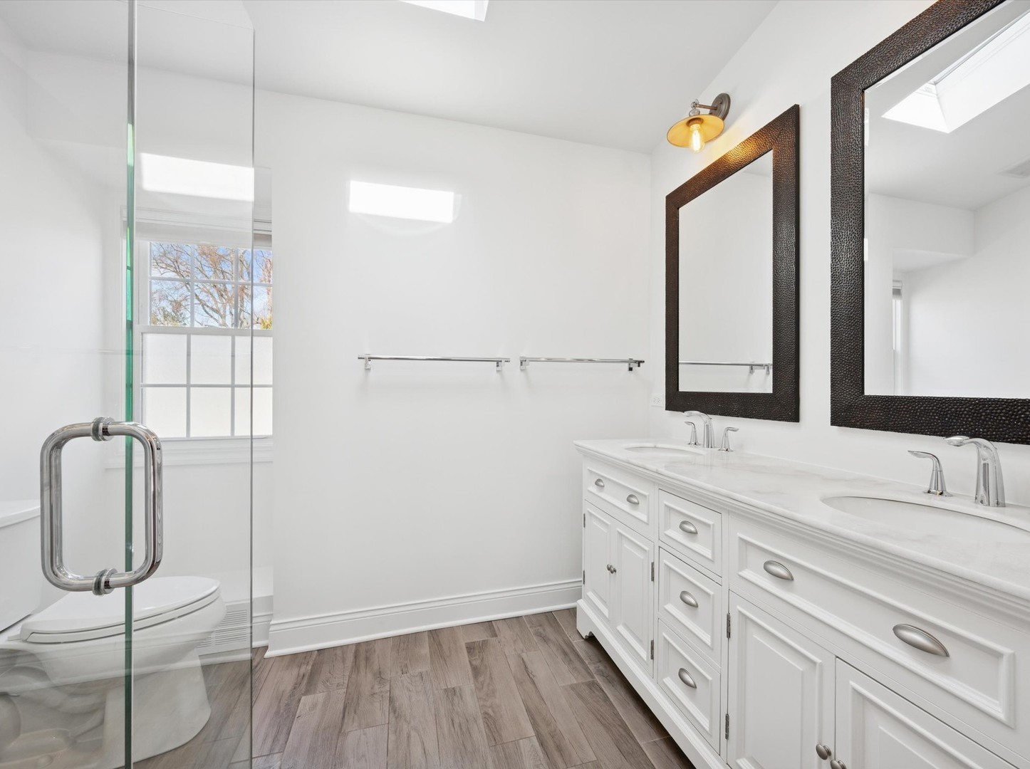 716 Indian Road Glenview, IL 60025 - Photo 16 of 32 a bathroom with a double vanity sink and mirror