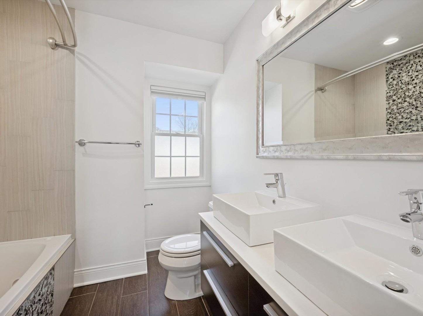 716 Indian Road Glenview, IL 60025 - Photo 20 of 32 a bathroom with a sink toilet vanity and tub