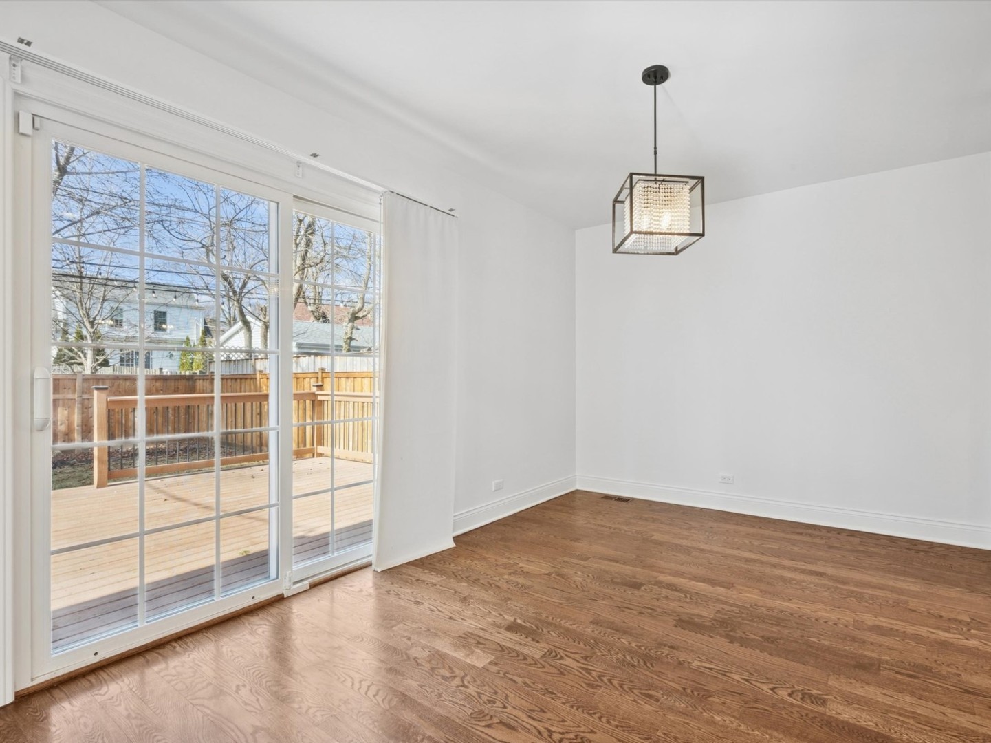 716 Indian Road Glenview, IL 60025 - Photo 6 of 32 a view of empty room with wooden floor and fan