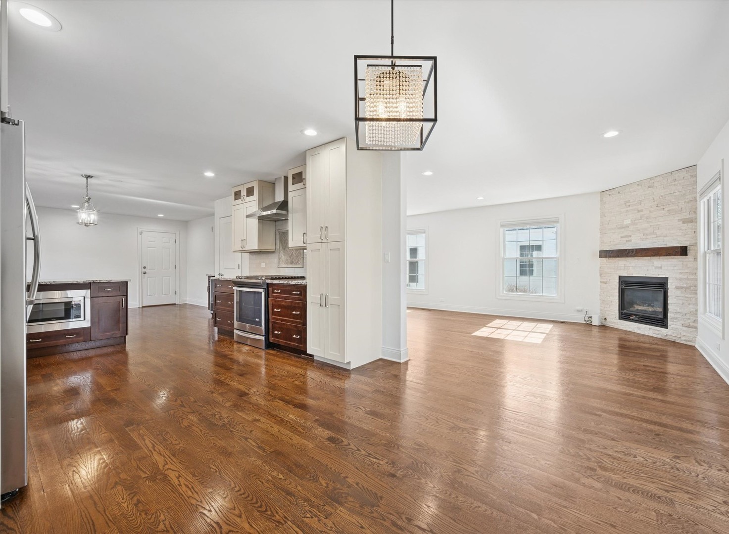716 Indian Road Glenview, IL 60025 - Photo 7 of 32 a view of a kitchen with furniture and a fireplace