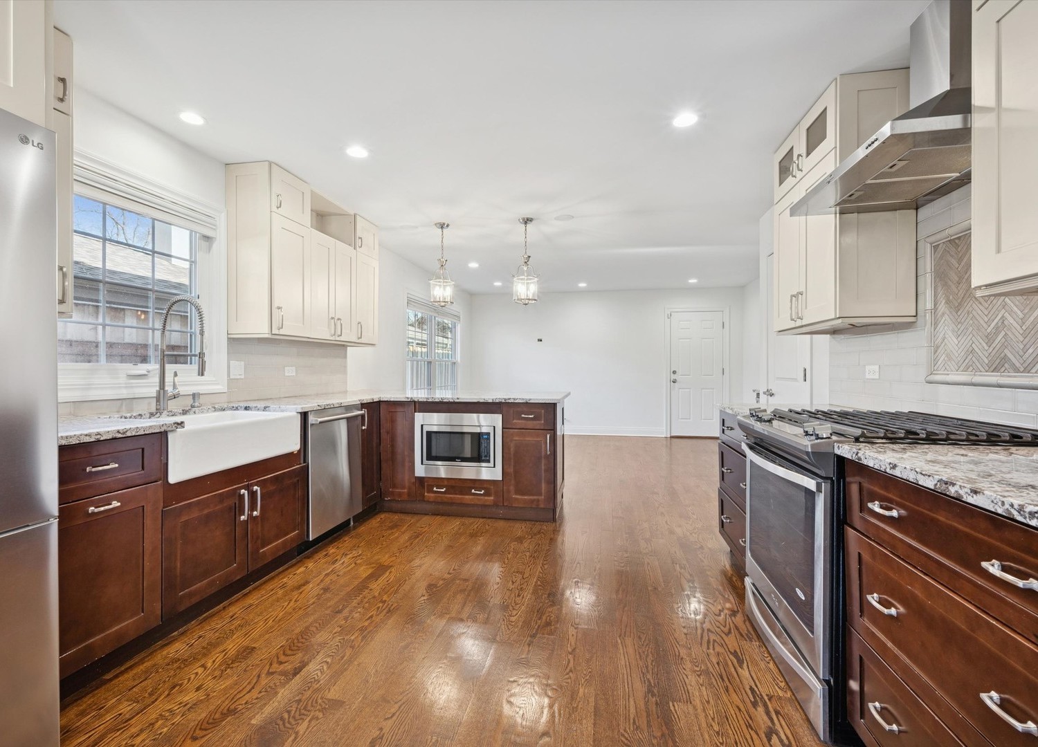 716 Indian Road Glenview, IL 60025 - Photo 8 of 32 a large kitchen with stainless steel appliances granite countertop a stove and a sink