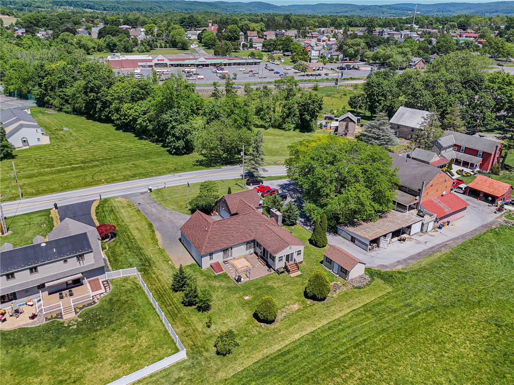 652 Old State Road Oley, PA 19547 - Photo 50 of 54 An aerial perspective reveals a verdant landscape surrounding a collection of residences and a well-maintained street.