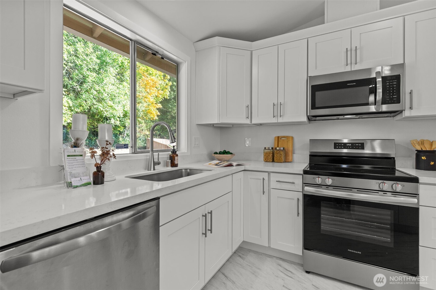 11822 56th Place South Seattle, WA 98178 - Photo 14 of 39 a kitchen with white cabinets and appliances