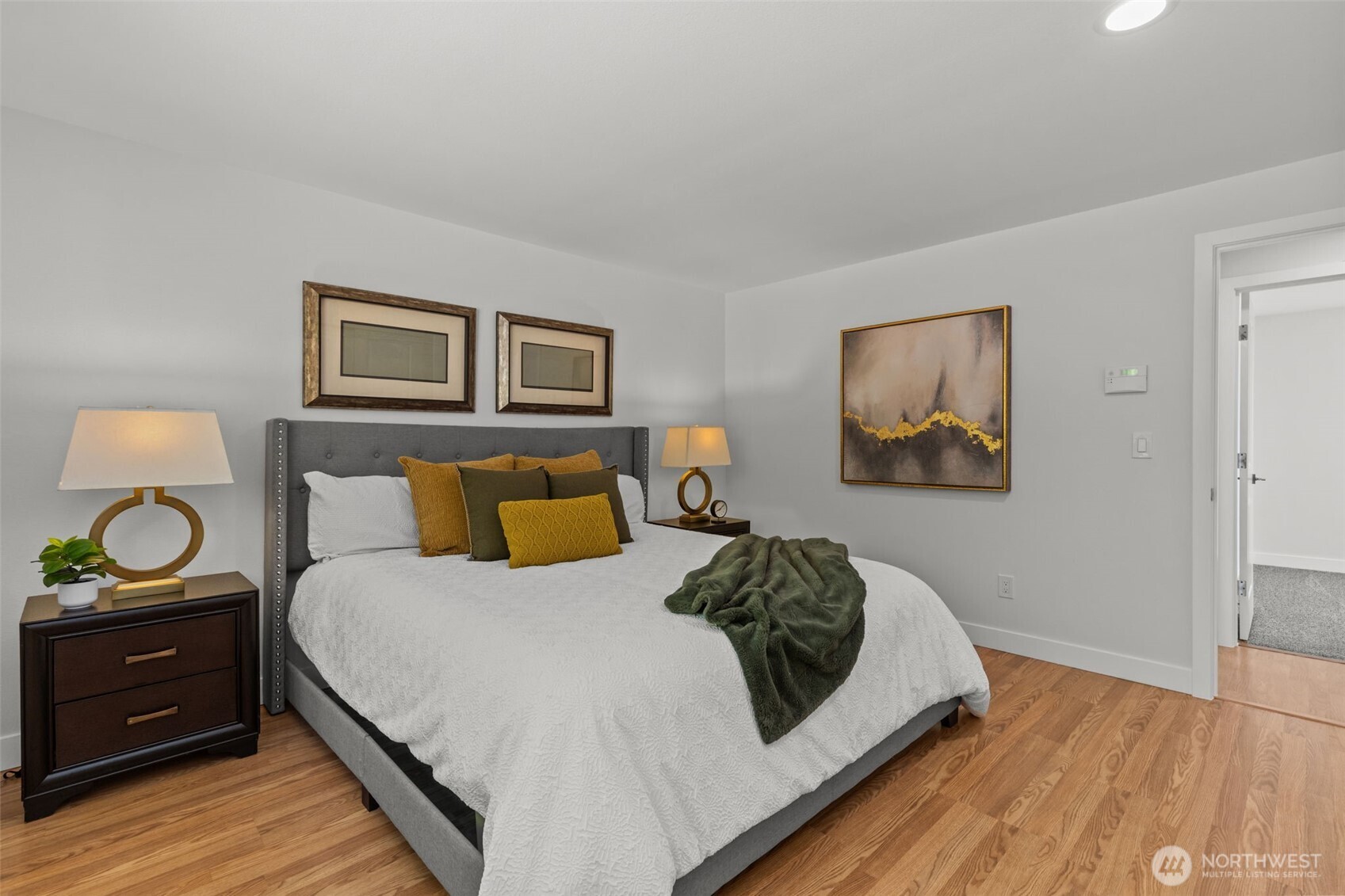 11822 56th Place South Seattle, WA 98178 - Photo 17 of 39 a bedroom with a bed and wooden floor