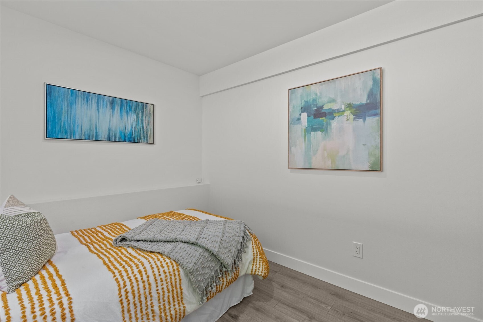 11822 56th Place South Seattle, WA 98178 - Photo 27 of 39 a bedroom with a bed and a painting on the wall